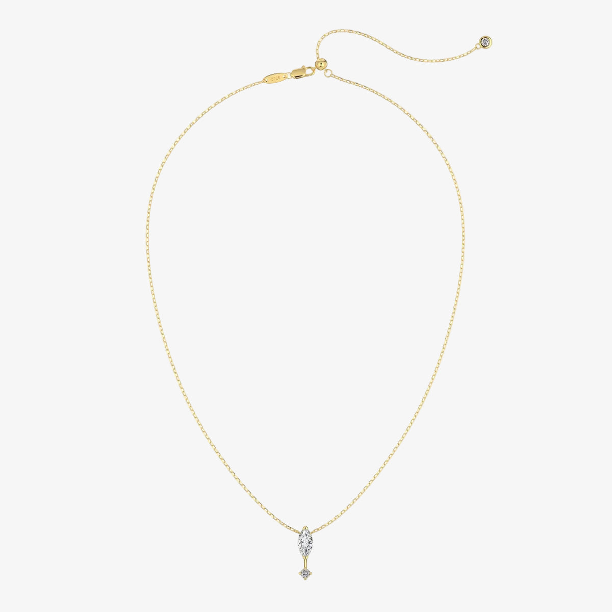 Gold necklace with a small pendant on a white background