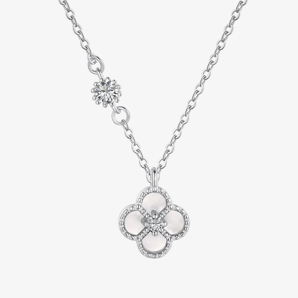 Silver necklace with a floral pendant on a white background