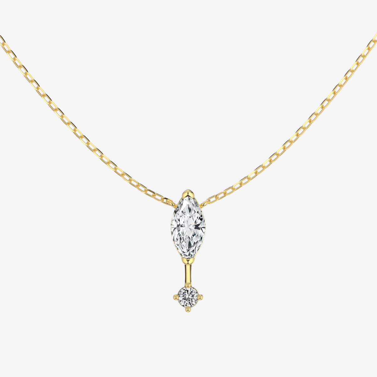 Gold necklace with a clear gemstone pendant on a white background